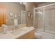 Bathroom featuring shower and tub combo, modern sink, vanity, and decorative art at 786 International Isle Dr, Castle Rock, CO 80108