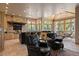 Open-concept kitchen and dining area featuring stone accents, natural light, and a breakfast bar at 786 International Isle Dr, Castle Rock, CO 80108