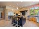 Spacious kitchen with an island, stone backsplash, stainless steel appliances, and pendant lighting at 786 International Isle Dr, Castle Rock, CO 80108