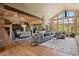 Spacious living and dining area with hardwood floors, stone accents, and oversized windows at 786 International Isle Dr, Castle Rock, CO 80108