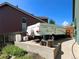 Driveway with a camper and lush backyard beyond the house at 8296 S Reed St, Littleton, CO 80128
