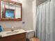 Clean bathroom with updated vanity, mirror, and shower for a fresh and modern feel at 8296 S Reed St, Littleton, CO 80128
