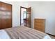 Cozy bedroom features a large closet and ample natural light at 8296 S Reed St, Littleton, CO 80128