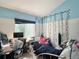 Bright bedroom featuring custom blue paint, white walls, and decorative flower vine accents at 8296 S Reed St, Littleton, CO 80128