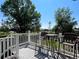 Outdoor deck with comfortable seating, perfect for enjoying the scenic views and entertaining guests at 8296 S Reed St, Littleton, CO 80128