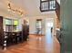 Elegant dining room with hardwood floors, a large table, and a view of the upper staircase at 8296 S Reed St, Littleton, CO 80128