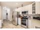 A kitchen with stainless steel appliances and light countertops at 4396 S Quail Way, Littleton, CO 80127