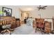 Bright loft with neutral carpet, wood desks, and a ceiling fan at 4396 S Quail Way, Littleton, CO 80127