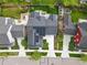 An overhead view of a home featuring solar panels, landscaped backyard, and modern architectural design at 6072 Chester St, Denver, CO 80238
