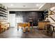 Spacious basement featuring a foosball table, arcade games, piano, and wet bar at 6072 Chester St, Denver, CO 80238