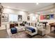 Cozy basement with a comfortable sectional sofa, pool table, and sports memorabilia at 6072 Chester St, Denver, CO 80238