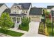 Charming two-story home with a well-manicured lawn, solar panels and a two-car garage at 6072 Chester St, Denver, CO 80238