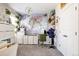 Bright office with a world map, white cabinetry, and a comfortable workspace at 6072 Chester St, Denver, CO 80238
