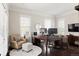 Bright home office with large windows, a comfortable chair, and a spacious desk at 6072 Chester St, Denver, CO 80238