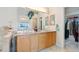 Bathroom featuring double sinks, spacious vanity, and ample lighting at 3337 W 113Th Ave, Westminster, CO 80031