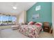 Bright bedroom featuring a window seat, colorful decor, and a ceiling fan at 3337 W 113Th Ave, Westminster, CO 80031