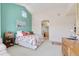 Well-lit bedroom showcasing bright walls, comfortable furniture, and access to an ensuite bathroom at 3337 W 113Th Ave, Westminster, CO 80031
