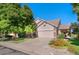 Charming home with a well-manicured lawn, beautiful flowering plants, and a two-car garage at 3337 W 113Th Ave, Westminster, CO 80031