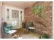 Cozy front porch with comfortable seating, charming brick accents, and a welcoming entrance at 3337 W 113Th Ave, Westminster, CO 80031