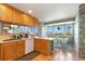 Bright kitchen with breakfast nook features wood cabinets, counter tops, and scenic views at 3337 W 113Th Ave, Westminster, CO 80031