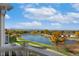 Picturesque view of a serene lake surrounded by colorful trees from the home's balcony at 3337 W 113Th Ave, Westminster, CO 80031