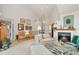 Open living room with a fireplace, vaulted ceilings, and a staircase to the second floor at 3337 W 113Th Ave, Westminster, CO 80031