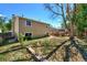 A spacious backyard with a fire pit, a retaining wall, and mature trees, is perfect for outdoor entertaining at 8483 Sandreed Cir, Parker, CO 80134