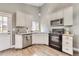 Well-lit kitchen with stainless steel appliances, granite countertops, and white cabinetry at 8483 Sandreed Cir, Parker, CO 80134