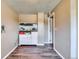 Living room featuring wood flooring, a fish tank, and ample storage space at 8483 Sandreed Cir, Parker, CO 80134