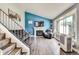 Bright living room featuring a fireplace, large window, and modern decor at 8483 Sandreed Cir, Parker, CO 80134