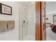 Bathroom showcasing a glass-enclosed shower with modern fixtures and tiled walls at 7312 S Moore Ct, Littleton, CO 80127