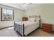 Bedroom featuring a ceiling fan, natural light, and neutral carpet at 7312 S Moore Ct, Littleton, CO 80127