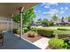 Inviting front porch featuring beautiful landscaping, manicured lawn, and views of the neighborhood at 7312 S Moore Ct, Littleton, CO 80127