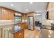 Spacious kitchen with stainless steel appliances, granite countertops, and ample cabinet space at 7312 S Moore Ct, Littleton, CO 80127