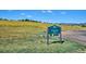 Sledding Hill Park sign surrounded by green grass and trees at 7312 S Moore Ct, Littleton, CO 80127