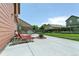 Spacious backyard patio with lounge chairs and a fire pit, perfect for outdoor entertaining at 9919 Memphis St, Commerce City, CO 80022