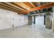 Unfinished basement space with exposed beams and concrete floor, ready for customization at 9919 Memphis St, Commerce City, CO 80022