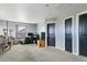Spacious bedroom includes multiple doors, a window, and plush carpeting at 9919 Memphis St, Commerce City, CO 80022