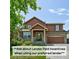 Charming two-story home featuring wood siding, stone accents, and a well-maintained front lawn and attached two-car garage at 9919 Memphis St, Commerce City, CO 80022