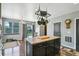 A spacious kitchen island and patio door provide excellent access to the backyard at 9919 Memphis St, Commerce City, CO 80022