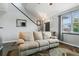 A well lit and well decorated living room with dark hardwood floors at 9919 Memphis St, Commerce City, CO 80022