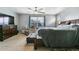 Spacious main bedroom with plush carpeting, ceiling fan, window, and a dresser at 9919 Memphis St, Commerce City, CO 80022