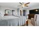 Large main bedroom showcases a ceiling fan, natural light, and dresser at 9919 Memphis St, Commerce City, CO 80022