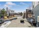 Backyard with a covered brick patio and stairs leading to an upper deck at 26531 E Calhoun Pl, Aurora, CO 80016