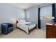 Cozy bedroom featuring natural light, chair, and a serene atmosphere at 26531 E Calhoun Pl, Aurora, CO 80016