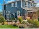 Beautiful two-story home with a shed in a well-maintained yard and striking blue siding at 26531 E Calhoun Pl, Aurora, CO 80016