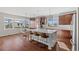 Bright kitchen featuring stainless steel appliances, wooden cabinets, and center island seating at 26531 E Calhoun Pl, Aurora, CO 80016