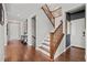 Elegant staircase with wood railings and white risers leads to the upper level at 26531 E Calhoun Pl, Aurora, CO 80016