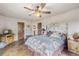 Cozy bedroom with southwestern-style decor featuring rustic wood furniture and a ceiling fan at 28098 Green Valley Ln, Conifer, CO 80433