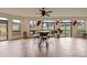 Bright dining area with tile floors, large windows, and views of the outdoors at 28098 Green Valley Ln, Conifer, CO 80433